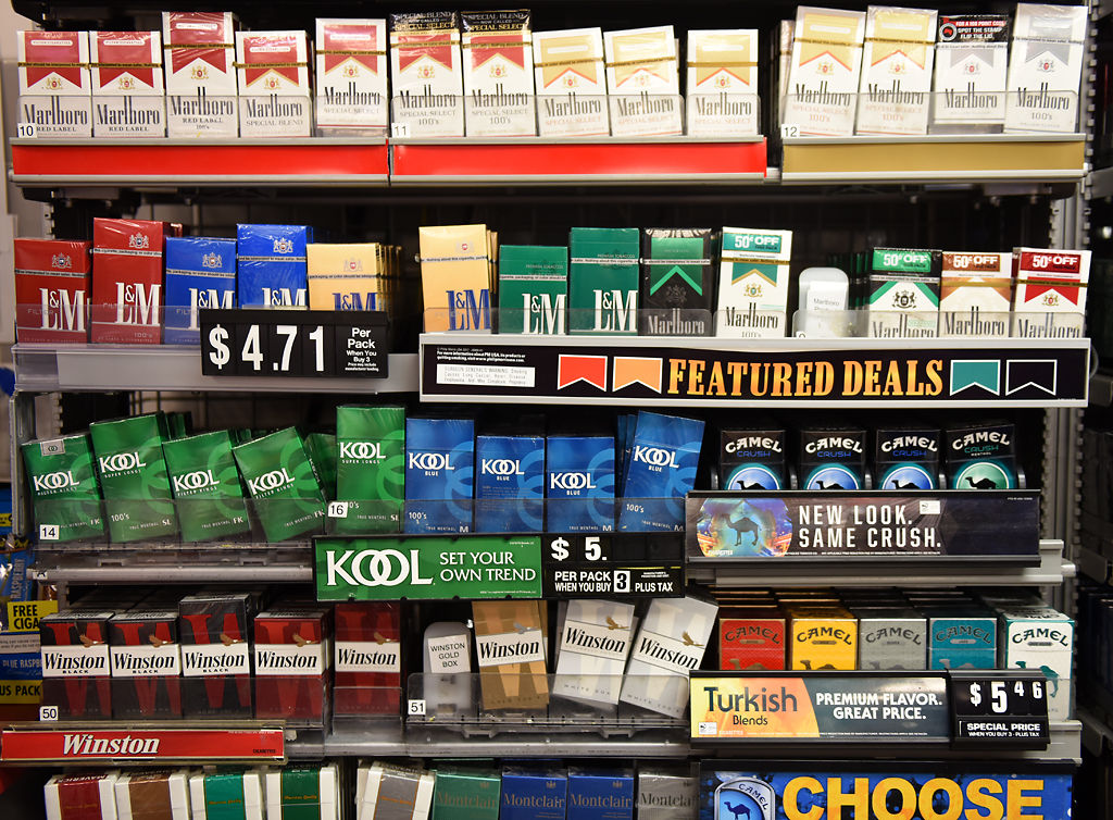 Cigarette packets line the shelves of Phillips 66 on College Avenue
